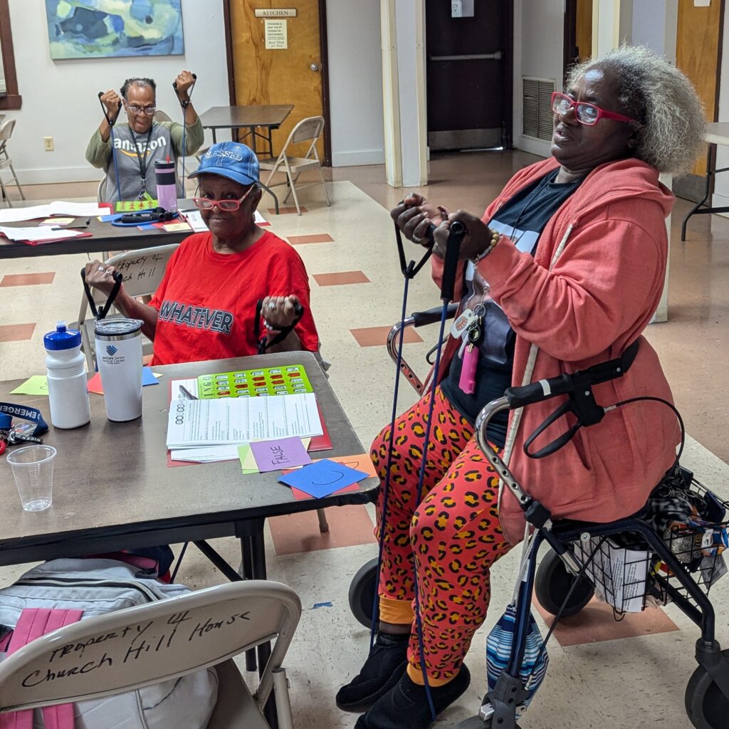 Older lady participants combining exercise with bingo.