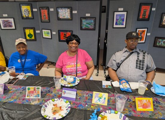 Participants snacking at the art gallery.