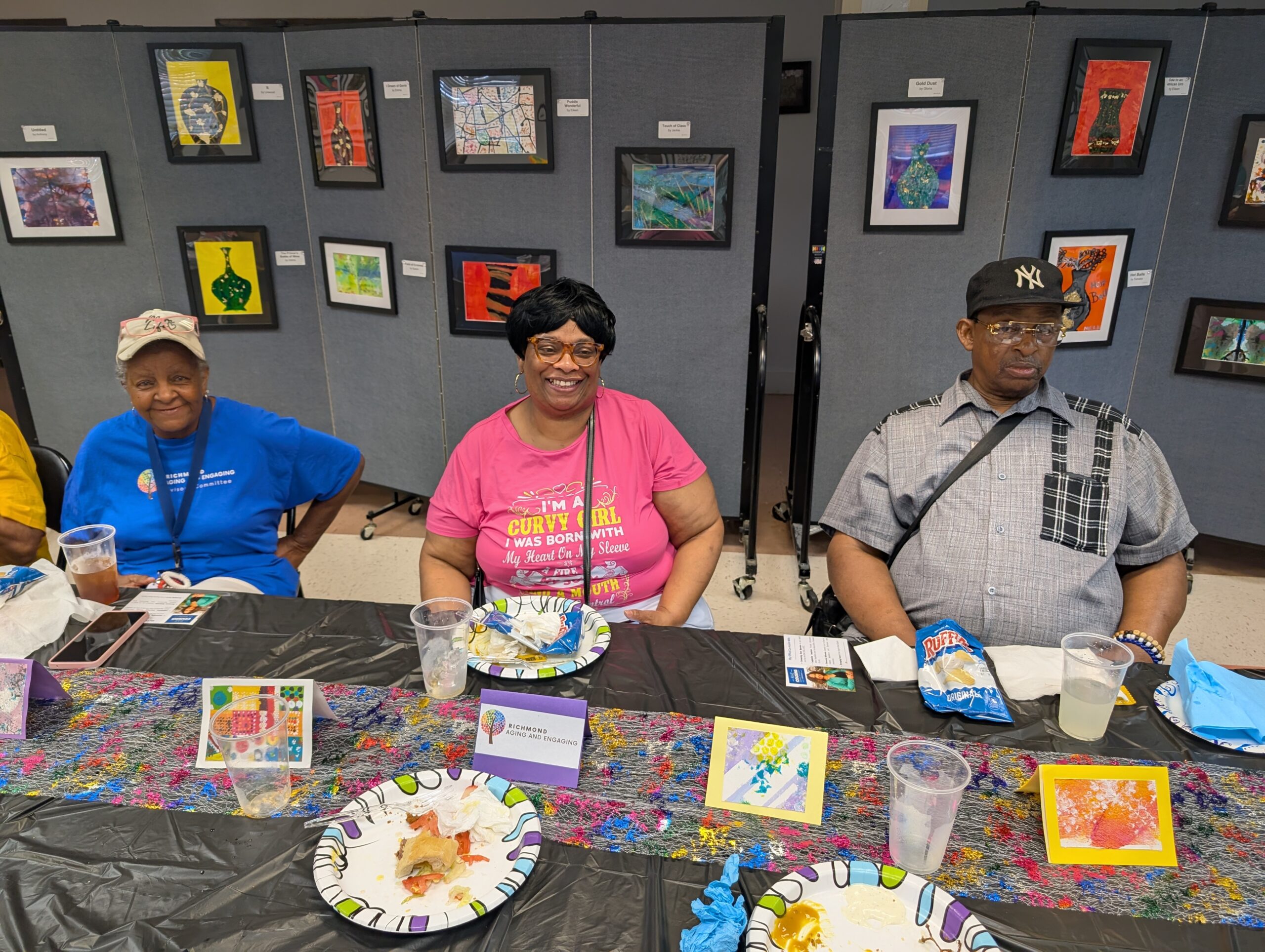Participants snacking at the art gallery.