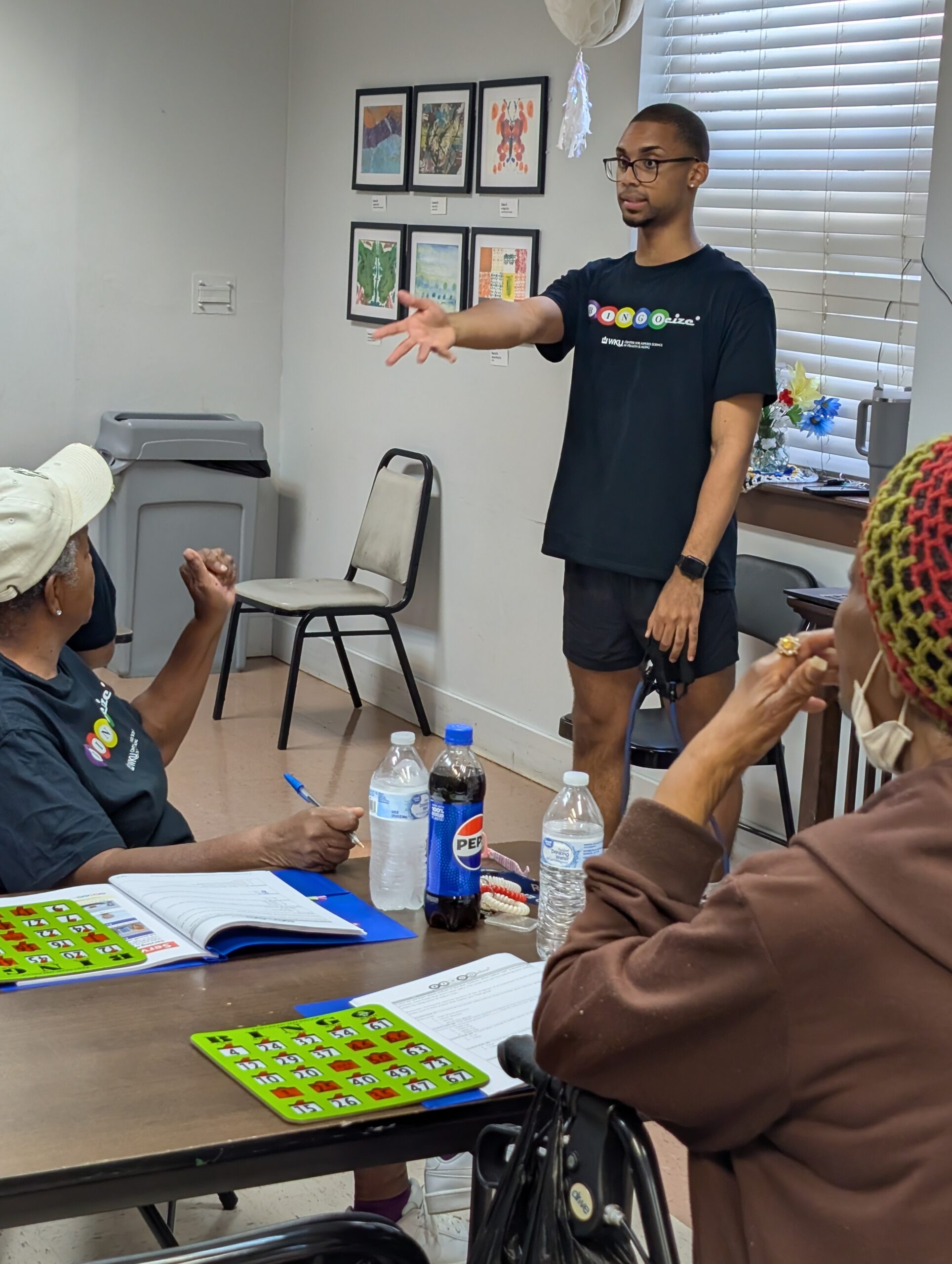 Volunteer calling out participants during a round of Bingocize.